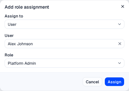 The Add role assignment dialog with an Assign to select, a searchable user picker, and a Role select