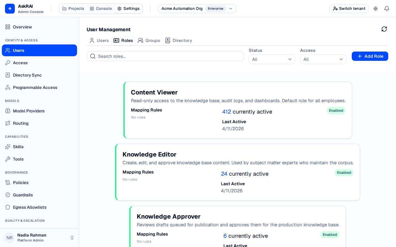Roles tab showing role cards with mapping rules, active users, and status